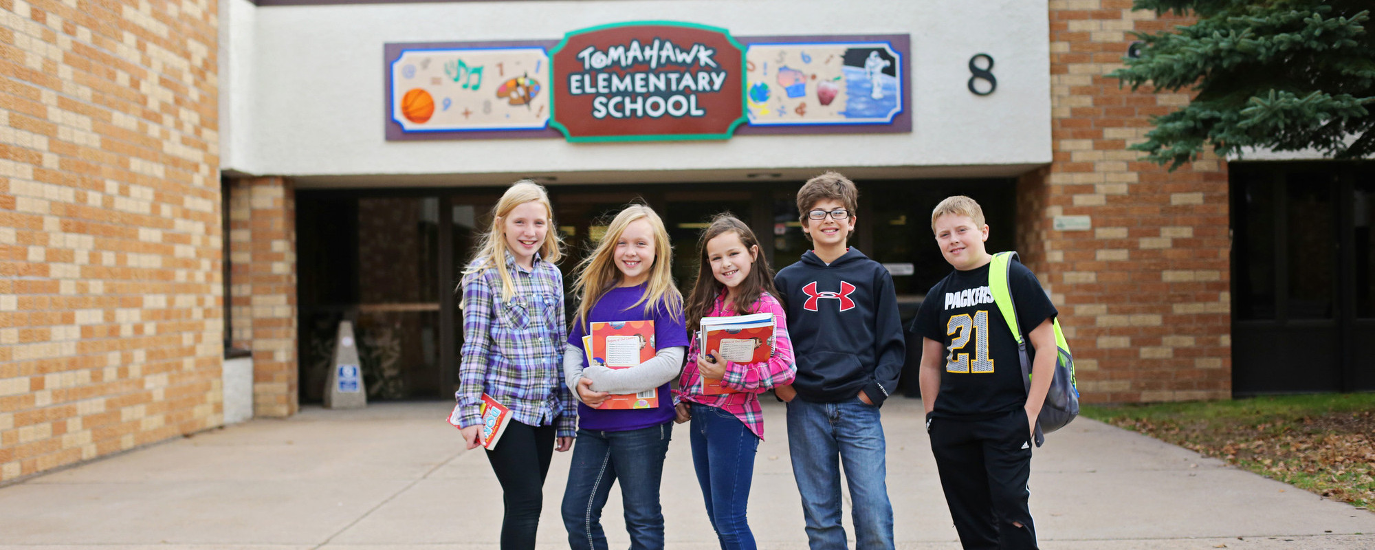 Elementary students outside school building
