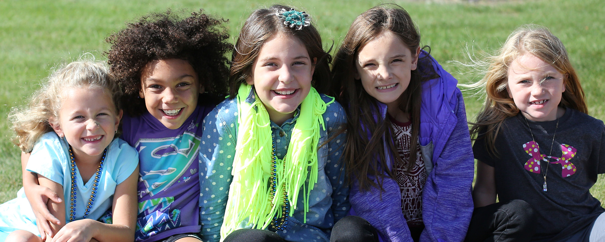 Girls smiling outside Tomahawk Elementary