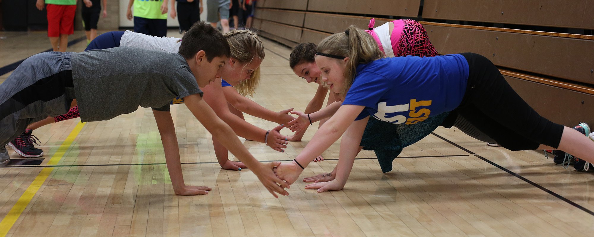 TMS students stretching in gym